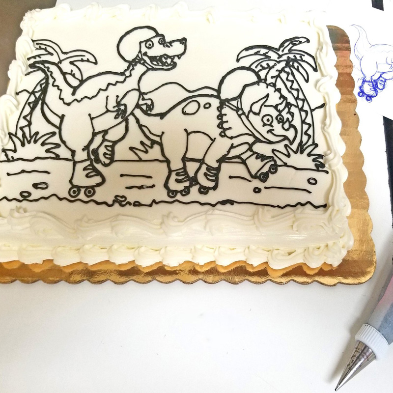 Rollerskating Dinos Coloring Book Cake