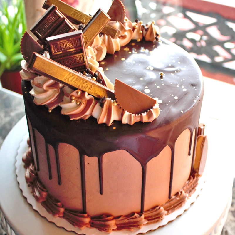 Gold Painted Candy Bars Over Chocolate Drip Cake